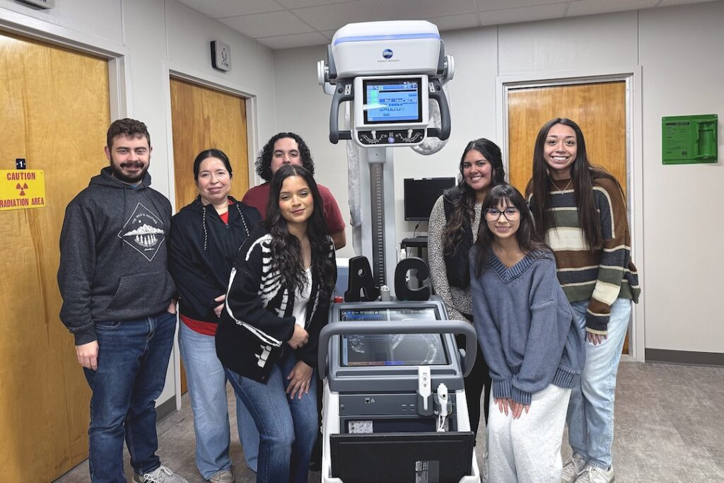 Students with Equipment (three photos):

Angelina College Radiologic Technology program students pose with the recently acquired Konica MKDR Express Portable X-Ray System. AC was able to purchase the new equipment thanks to funds from the Carl D. Perkins Basic Grant administered by the Texas Higher Education Coordinating Board. (Contributed photo)