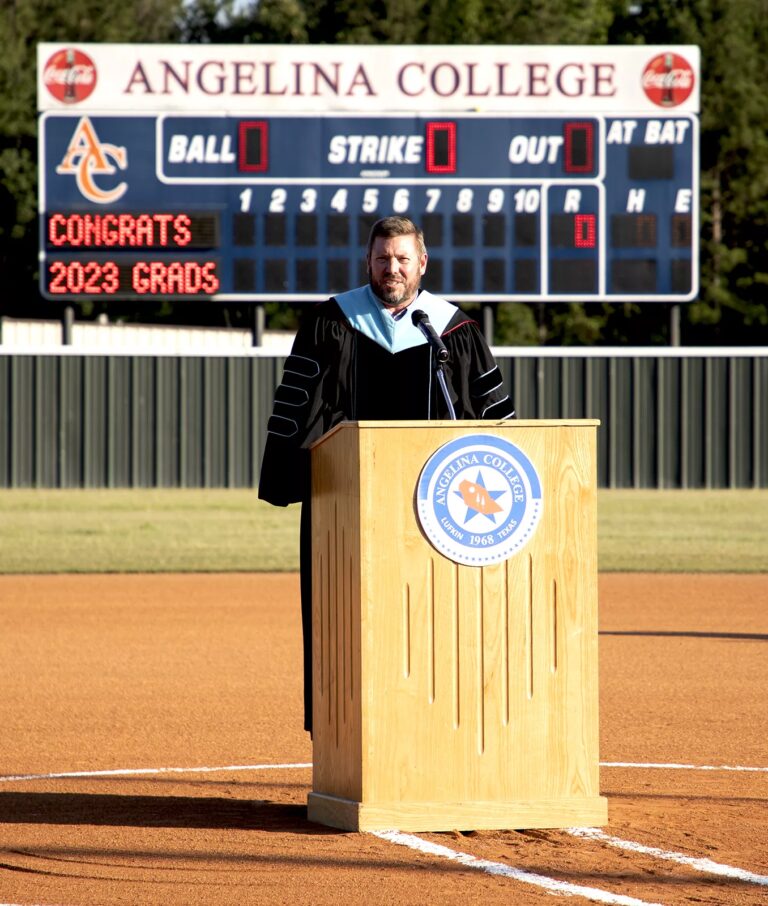 The college president speaking at an event