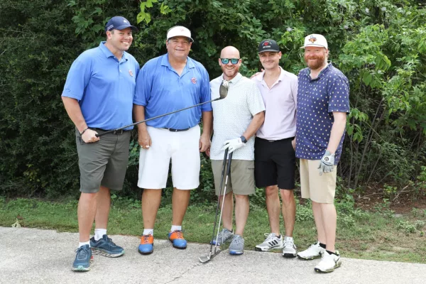 The college president at a charity golf tournament