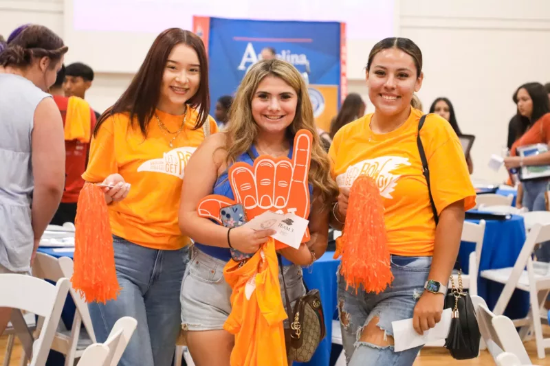 Students at orientation wearing orange