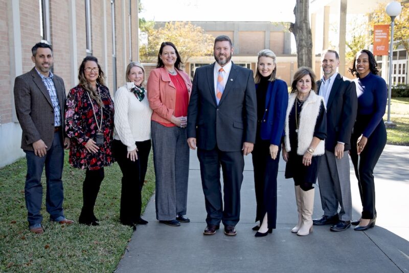 Members of the Angelina College Executive Council pose for a photo on the AC campus. The college recently earned a perfect score on its10-year reaffirmation of accreditation following an On-Site Reaffirmation Committee representing the Southern Association of Colleges and Schools Commission on Colleges’ (SACSCOC) —AC’s first perfect review since its opening in 1968. Pictured are (L-R), Chris Sullivan (Vice President of Business Affairs); Leigh Ann Pyle (Executive Director of Institutional Advancement); Ashley McElhinney (President’s Office); Joy Medford (Executive Director of Institutional Effectiveness); Dr. Michael Simon (President); Krista Brown (Vice President of Student Services); Dana Smithhart (Executive Director of Student Affairs); Dr. Tim Ditoro (Vice President of Academic Affairs); and Dee Ellis (Assistant, Human Resources).