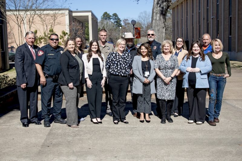 Angelina College faculty, staff, and local law enforcement representatives pose together outdoors following the Criminal Justice Q&A event.