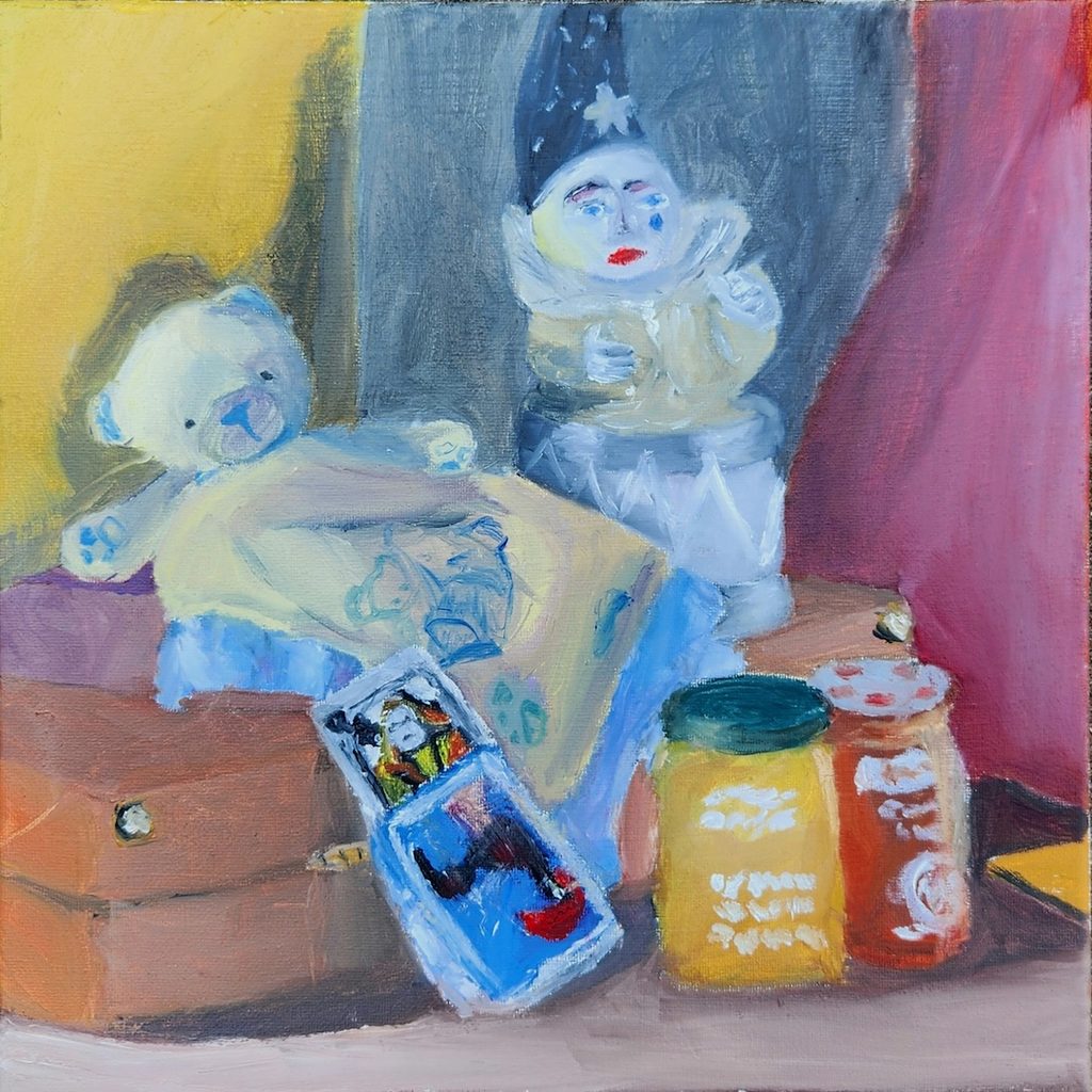 Oil painting of a teddy bear and clown figurine on a box, with two glass jars and a small card in the foreground.